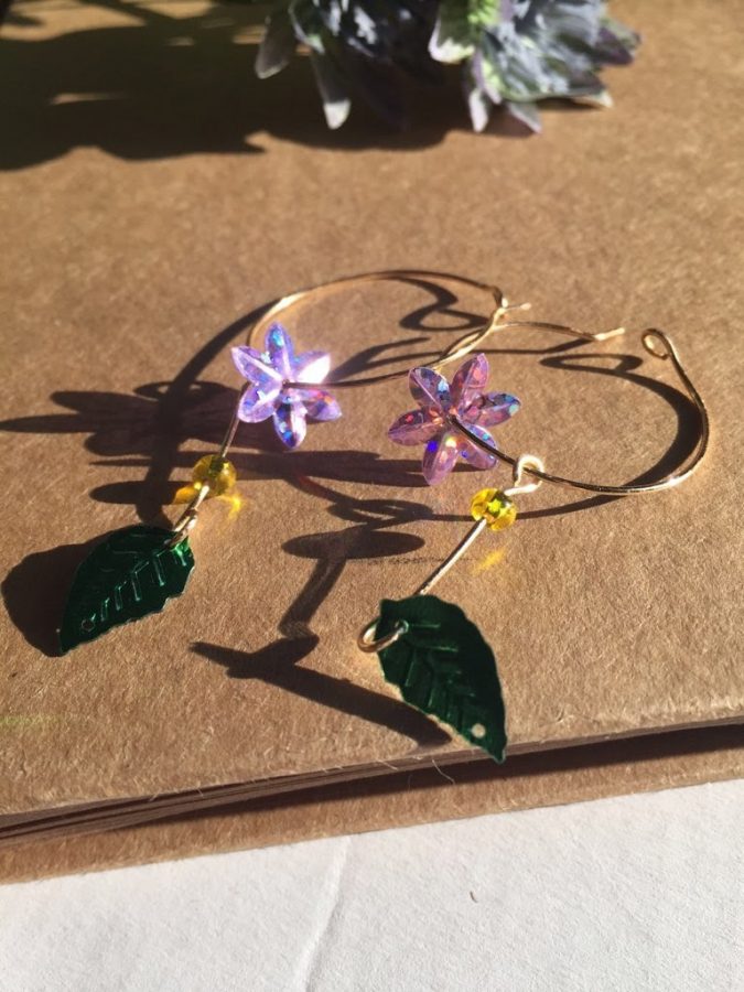 This pair of flower earrings is one of the many designs Lindsey Kim (12) creates in her freetime. Picture Courtesy of Lindsey Kim. 