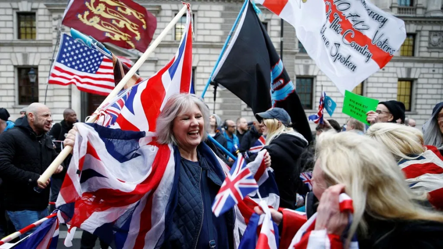 Britons celebrate Brexit on January 31st.  Photo courtesy of Henry Nicholls/Reuters.
