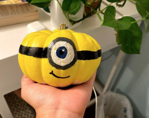 As Halloween creeps closer and closer, Kate Phan (10) and Molly Paulson (10) paint minion designs on mini pumpkins. Despite the restrictions on traditional Halloween gatherings, Phan expressed, “Surprisingly I actually love quarantine. I dont really have many friends to hang out with, Ive learned quality over quantity.”  
