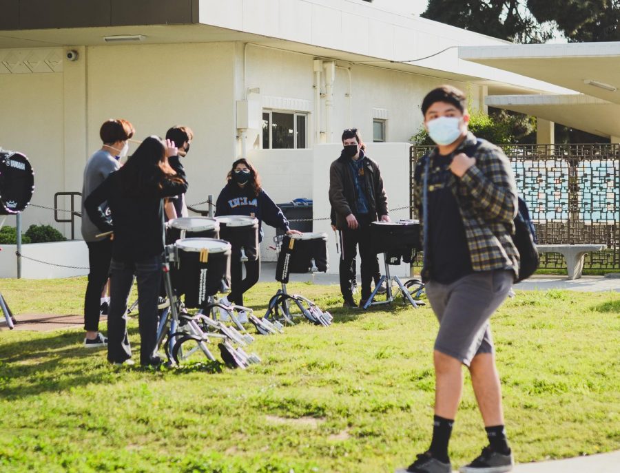 Greeted by the enthusiastic beats of drumline, students walk back onto campus for the first time in a long time. 