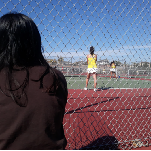 At tennis’ first League match of the season, the fence that was once engulfed by families and fans was replaced by a handful of supportive parents and teammates in response to the recent TUSD spectator guidelines.