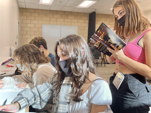 Preparing for this year’s Fall play, Play Production members Taylor Gulbrandsen (11), Jade Leone (11), and Natalia Torres (11) study their lines as they prepare for rehearsal. “I’m excited to have an in person audience,” Leone expressed. “It’s been a while since we have been able to have people watch [the plays] in person!” West students, staff, and families will be able to enjoy the show live in the West High Performing Arts Center on November 18, 19, and 20.