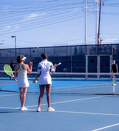 The North tennis court is swarmed with intense games and good attitudes. West Girls’ Tennis team trained hard to bring out their best performances, concluding their October 25 match with a clever save at the end of the last set. “We won literally by two points!” Coach Jin of West’s team exclaimed. “It was a close one… but we came out with the victory!” Photo courtesy of Samantha Takeda (11).