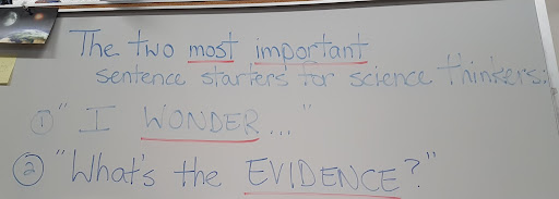 Science teacher Mrs. Chambers keeps a list of questions that scientists should never stop asking on her whiteboard for all students to see. Mrs. Chambers believes that the structure of the science education system “beats the joy” out of learning science the right way.