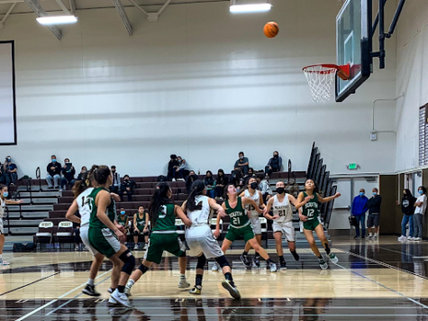 Players on the West Girls’ Basketball team have their eyes on the ball, waiting to reach for a missed shot from South. Among them is Varsity team captain Ella Estabrook (12), voted Southern California’s Girls Athlete of the Week as well as the Daily Breeze Girls Athlete of the Week!