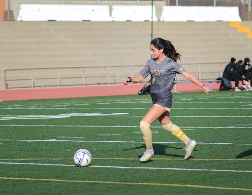 Practicing shooting during warm-ups, West High Girls’ Varsity Soccer player #8 Cherrie Cox (12) prepares for the game against Palos Verdes High School on Wednesday, December 15, 2021. Cox has played soccer her entire life and recently committed to playing for Cal State Long Beach. 
