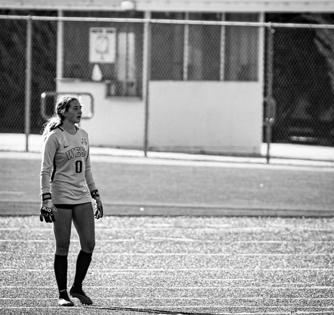 Lucy Hasenmayer (10) is the goalkeeper for West Girls’ Soccer. During games, Hasenmayer looks out into the field and guides her teammates whenever necessary. She reflected, “I was not so good at [playing] field, but [my dad] wanted me to try goalkeeping . . . turns out I was actually pretty good at it.” Photo courtesy of Lucy Hasenmayer.
