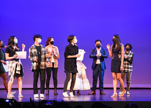 Talent show participants cheer as first place talent show winner Sarayu Kocharlakota (10) makes her way up to the front to receive her award. West High’s Choir Department hosted the West High’s Got Talent show on Thursday, February 10 in the Performing Arts Center. Kocharlakota shared what singing means to her: “Singing is my stress-buster; It’s the only thing that makes me forget about everything else. It fills me with happiness and helps me connect with people all around.”  