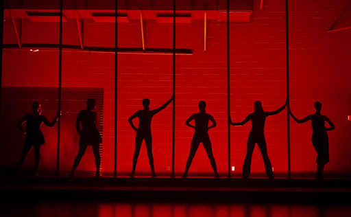 The actors playing the Merry Murderesses and Velma Kelly pose in their special lighting for the “Cell Block Tango.”