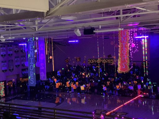 On March 25, the gym was transformed into a new world as glowing, fluorescent colors filled the otherwise dark room. Freshman ASB President Angelina Quiroz (9)  remarked, “Promoting class spirit is basically our whole job as ASB, so having a Glow Rally with so many bright colors, decorations, paint, grade competitions, and more surprises would really help with that!” Art/Photo courtesy of Ayane Kawanishi (12).