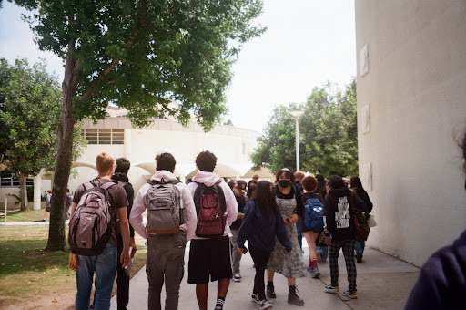 Walking through the hallways of West High for the last time, Cameron Marsh (12) and his friends reminisce about their best moments in high school. Before beginning their new journey, the class of 2022 made the most out of their last week at West High. 
