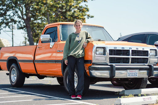 With a smile as vibrant as her car, Isabel Reynolds (12) mirrors the energy Starla—her classic orange 1992 Dodge D150— radiates. “My favorite thing about my car is that it’s orange and to me, the color orange represents excitement and happiness,” she said 
