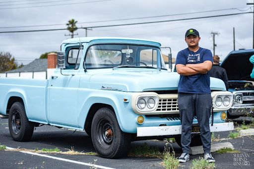 Proudly standing next to his 1958 Ford F-350, Carlos Herrera (11) showcases the old-school vibes of his classic truck. “One thing I like about my car is the sound . . . It reflects my personality because it is old school,” Herrera expressed. 