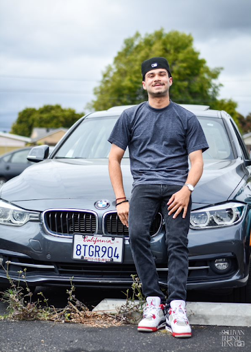 Leaning on his 2018 BMW 3 Series 330e, Mohamad Hindi (12) explained, “My car reflects my personality because it is sporty. It sets the vibe when I drive.” 
