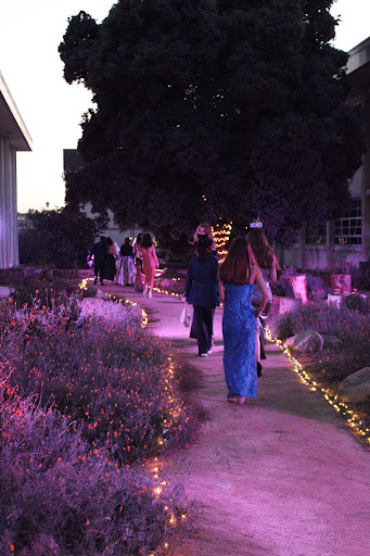 Students make their way down the whimsical garden path into the Mad Tea Party Formal Event. The day before, as ASB set up the campus, ASB Advisor Ms. Eriksen expressed her excitement: “I think people will be surprised at what school can look like when you throw some different lighting on it. I’m looking forward to it!” Photo courtesy of Gaby Nieraeth (10).
