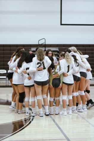 West Highs Girls Volleyball team huddles up after scoring a point against Palos Verdes  High on September 1, 2022. The team plans their next play to get that “Warrior win”. Outside of brainstorming their next play, the girls build up positive momentum to keep them in the right mindset throughout the whole game. The girls support each other, and when one teammate fails a play, they build each other back up without giving up. 