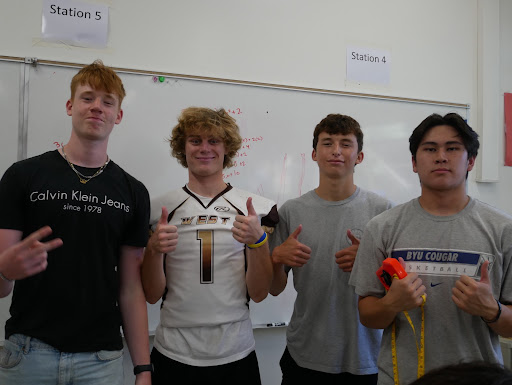 In the classroom, Nico Kleinke (11) (left) discusses the differences between schools in Germany and America with his teammates Kyle Cascalenda (12), Zachary Mercieca (12), and James De Castro (12). This year, West High has welcomed many foreign exchange students who work to adjust to the American lifestyle, joining new clubs, sports, and other extracurricular activities.