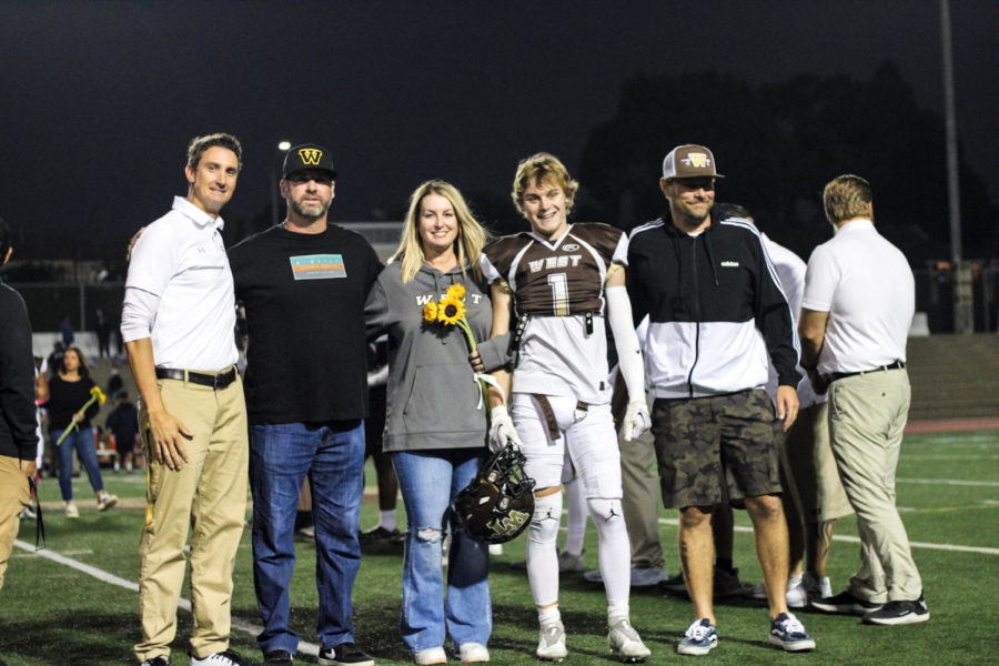 Wide receiver, running end, and defensive back Kyle Cascalenda (12) and family.