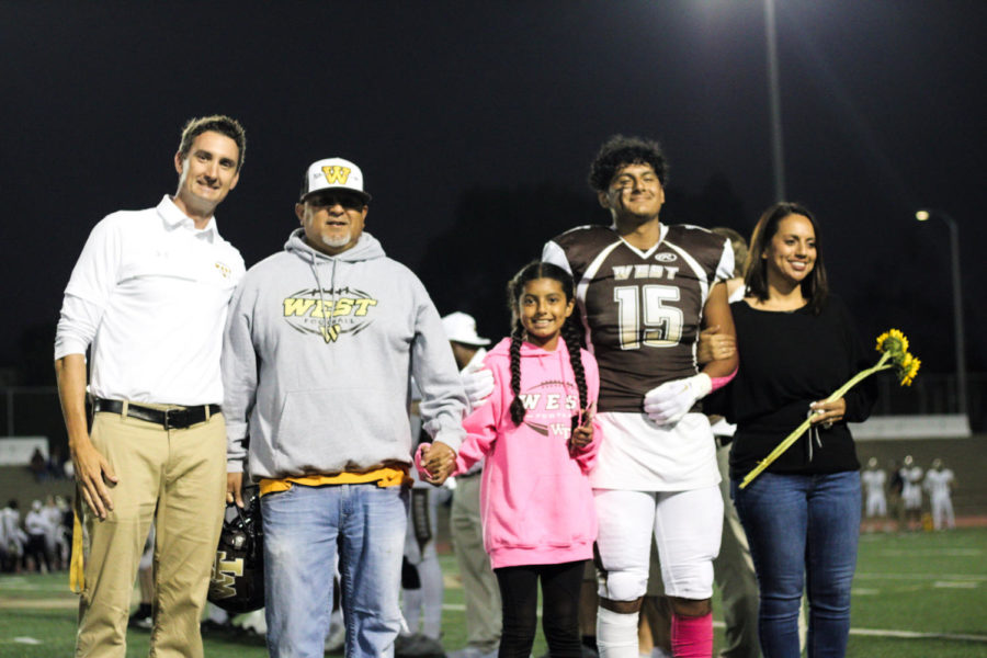 Wide receiver and safety Dominick De La Torre (12) and family. 
