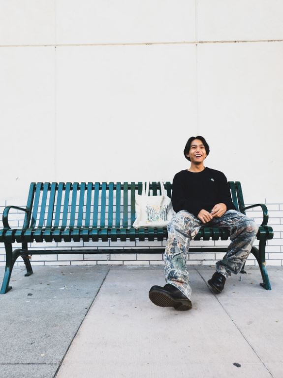 Fontanilla describes his shoes and pants as “more of a military vibe to the outfit, but the sweater balances everything out, so [the military vibe] is not too strong.” (Art/Photo by Darren Kawazoe)