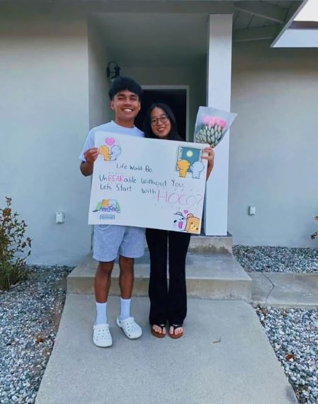 A Beary Sweet Ending. Nathan Espiritu (10) asks Christina Kim (10) to spend the Homecoming dance together with a “beary” unique poster! Undoubtedly, the prolonged wait for Espiritu to see Kim’s reaction to his poster was un-bear-able. Espiritu stressed, “All I could think about was if I messed up on the poster and I didn’t notice, or what if I look dumb right now.”  His worries faded away when Kim was overjoyed at the sight of the poster.  (Art/Photo courtesy of Isabelle Espiritu (8)) 