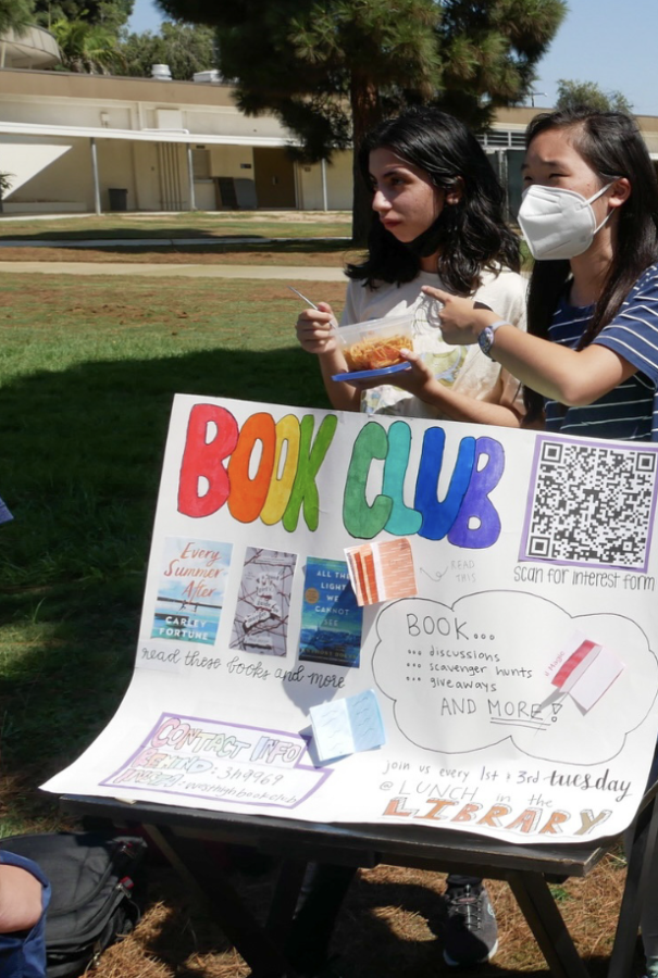 Book Club board members Kyna Sarhaya (10), Isabella Chow (10), and Sue-Yan Chin (10) advertise the new club with bright posters and popular books lining the table.  On September 14, 2022 Book Club attended Club Rush in hopes of encouraging students to join. President Morgan Tan (10) noted the importance of reading as it is “a lifelong hobby that makes you a more well rounded person.”
