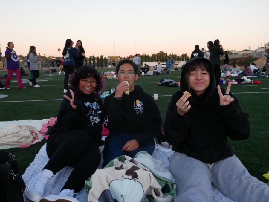 Mars Padi (12), Jake Nguyen (12), and Karen Kato(12) are all smiles with their free breakfast provided by West High. Many seniors were hesitant to attend since the event was so early in the morning. Paddi and their friends went since “it was talked about a lot by past upperclassmen friends.” In the end, Paddi felt it was their responsibility as a senior to make the most of their last year.