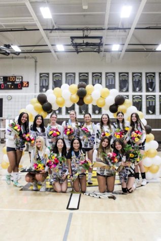 West High’s Girls’ Volleyball seniors huddle up for a group picture on senior night against North High on Wednesday, Oct. 12, 2022. Congratulations to (top row from left to right) Amani Flakes (12), Samantha Jiao (12), Mikayla Long (12), Maddy Hancock (12), Kate Amano (12), Rylee White (12), Aaliyah Martinez (12), Maddie Verette (12),(bottom row from left to right) Abigail Witzansky (12), Sheridan Hagedorn (12), Maddie Gloria (12), Mia Koliander (12), and Paityn Yamasaki (12) for representing the Girls’ Volleyball program.