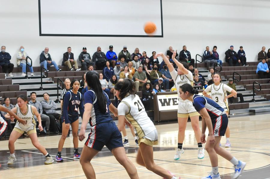 She shoots, she scores! Determined to make her free throw, Madeline Heinemann (11) hoped to rack up points on the scoreboard for her team. West Girls’ Basketball battled St. Paul High School in the First Round of CIF after placing first in Pioneer league. 