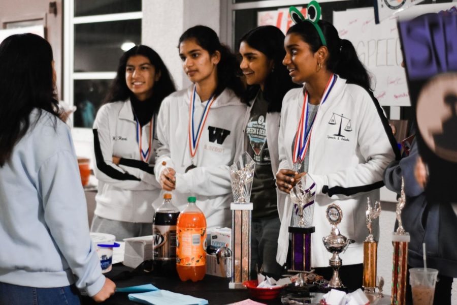 From left to right: Hridhya Sukumaran (11), Rithika Yalla (11), Simran Bhattacharya (11), Pranati Anna (11). Adorned with various competition medals, Speech and Debate encourages curious students to join their club at West Fest. After selling root beer floats and passing out flyers, Captain Rithika Yalla (11) explained that the highlight of the night was bonding with her fellow members: “For me, its really just the memories that you make with that . . . That’s what stood out to me.”