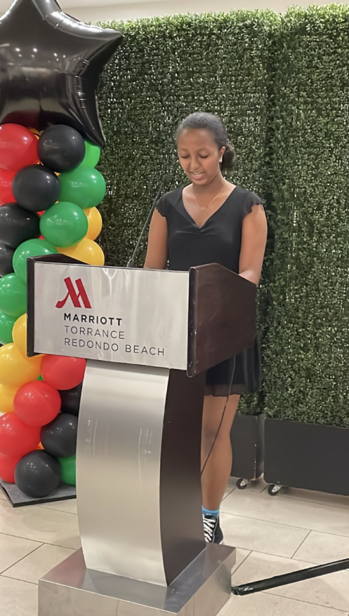 West High Black Culture Club Secretary Zara Simon (10) reads her poem “My Skin” at the 22nd annual “Continuing the Legacy” event for the Torrance Area Chamber of Commerce on March 2. Photo courtesy of Mrs. Murata.