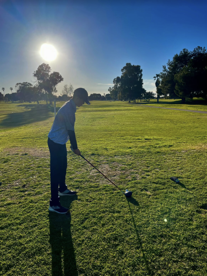 Micah Taw (11) enjoys practicing his big swings at the driving range. He appreciates that golf is a sport that revolves around teamwork and sportsmanship, as it “does not only offer support, but also offers an opportunity to bond closer with teammates.” Photo courtesy of Micah Taw (11).