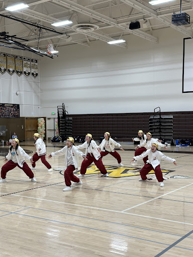 Japanese dancers line up to perform for West’s accepting and enthusiastic crowd. Gracie Ito (11) thought the event was great, as it gave West’s drill and all male team time “to bond with them since [they were] going to nationals together.”