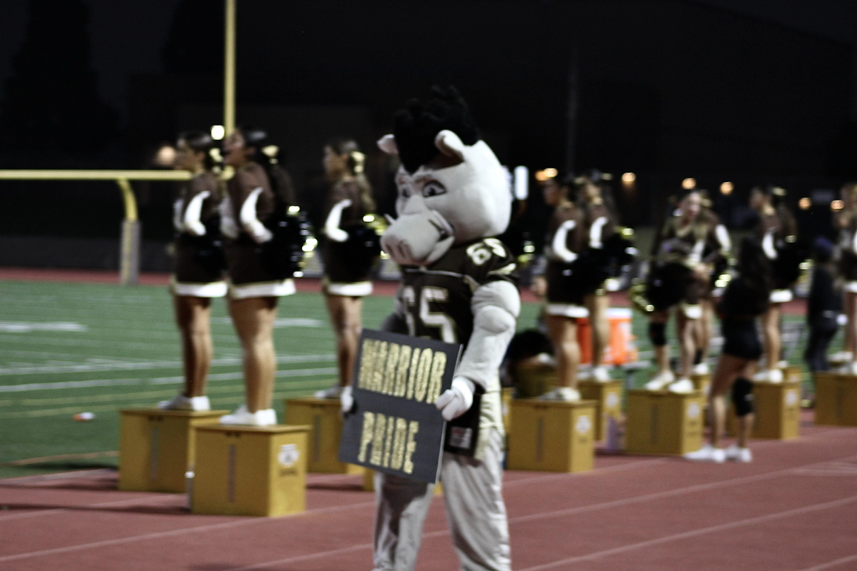 Westin the Warthog shows his Warrior Pride during a game. As he walked down the field, cheers could be heard from the student section sending love to our new hype man.