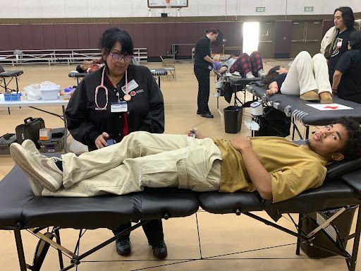 A nurse takes the blood of volunteer Aeonn Rubi (12). Both sweet and brave, theyre heroes. Thanks to those who donated and those who volunteered. You’re truly making a difference. 