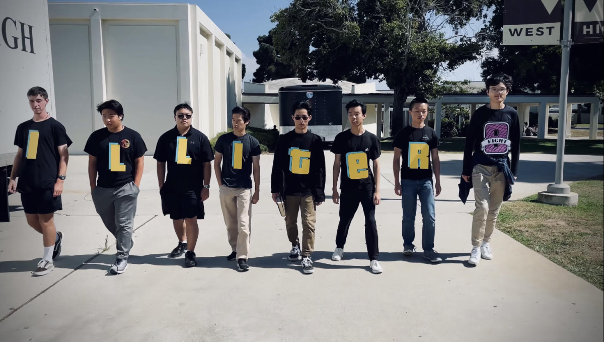 Philip Lam (12), along with Jonathan Valot (12), Isaac Kim (12), Alex Matsuoka (12), Yuhan Jia( 12), Luke Chiang (12), Aaron Hui (12)  and Hank Cao (12) walk to the stadium just in time for their senior panoramic. Their ironic “Illiter8” shirts remind them of the friendship they’ve created, knowing that soon they will go their separate ways. But for these (very much literate) guys, there seems to be no fear as they approach the beginning of the end of high school.