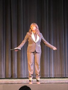 Ayleen Zavala (12) delivers an oral interpretation incorporating multiple perspectives of society relative to the sexualization and social status of Latina women. She referenced the behavior of men in society when it came to their treatment of this group of people. Using this performance, she intended to empower Latinas to fight against those who believe they are superior to these women.