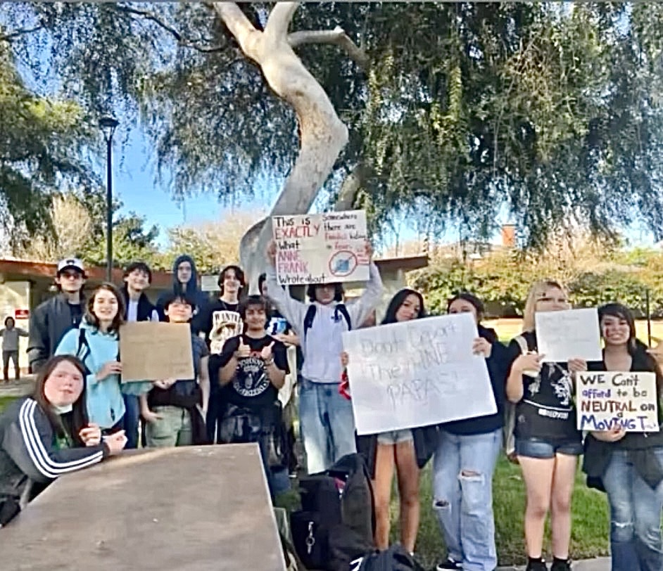  West High ICE protesters pose at Victor Park. They all held signs that called for ICE’s expulsion from communities across the country. This walkout was one of many that have been occurring throughout the U.S in response to the injustices that the Trump administration perpetrated during its immigration crackdown.