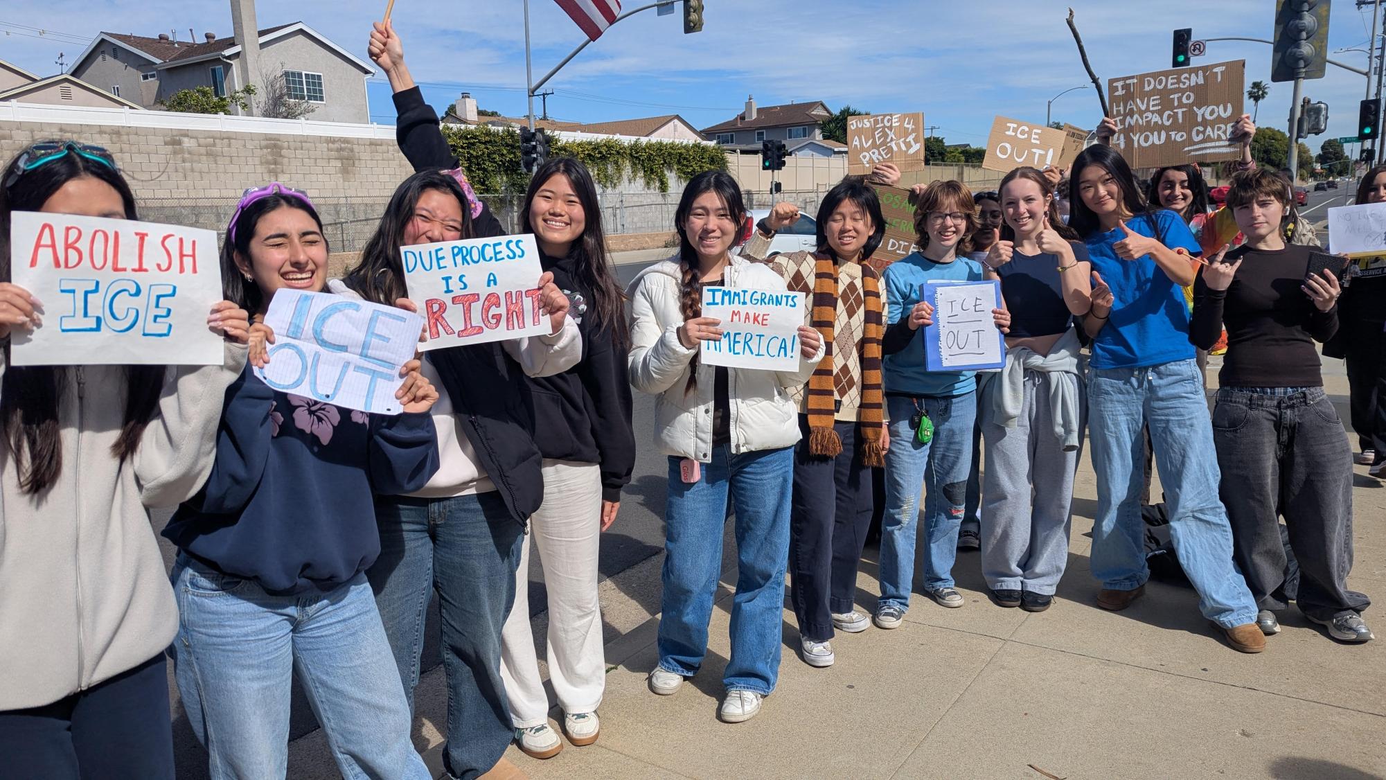 West High students stand along a road holding signs to protest rising ICE detention rates and enforcement raids. These protesters demanded an end to unregulated detention facilities and advocated for the protection of basic human rights for all residents. By calling for "due process," they sought to highlight the moral contradictions within the legal system and government actions’ negative impact on families across the nation.
