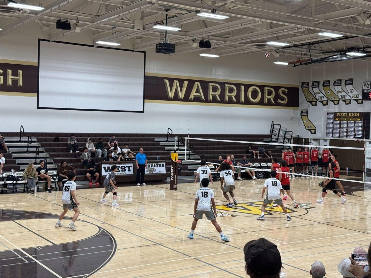 The West High boys’ varsity volleyball team watches with anticipation as the volleyball soars through the air to their opponent's side, Palos Verdes. This match concluded the end of the season as well as the volleyball careers for many of the seniors during their senior night. Ultimately, the team won with a narrow victory of 15-13 on their last set.  